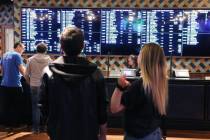 Patrons check out the new sportsbook at Park MGM on Friday, March. 6, 2020, in Las Vegas. (Bizu ...