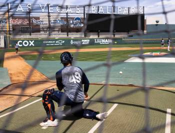 The Las Vegas Aviators catcher JJ Schwarz (49) catches the ball during media day practice at th ...
