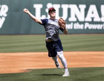The Las Vegas Aviators outfielder Marty Bechina (7) throws the ball during media day practice a ...
