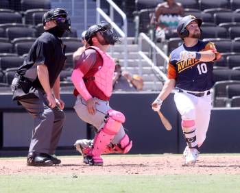 Aviators second baseman Nate Mondou dons pink socks as he watches a fly ball as the Sacramento ...