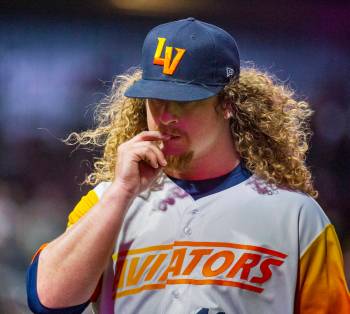 Las Vegas Aviators pitcher Grant Holmes (11) bites a nail on his way to the dugout versus the S ...