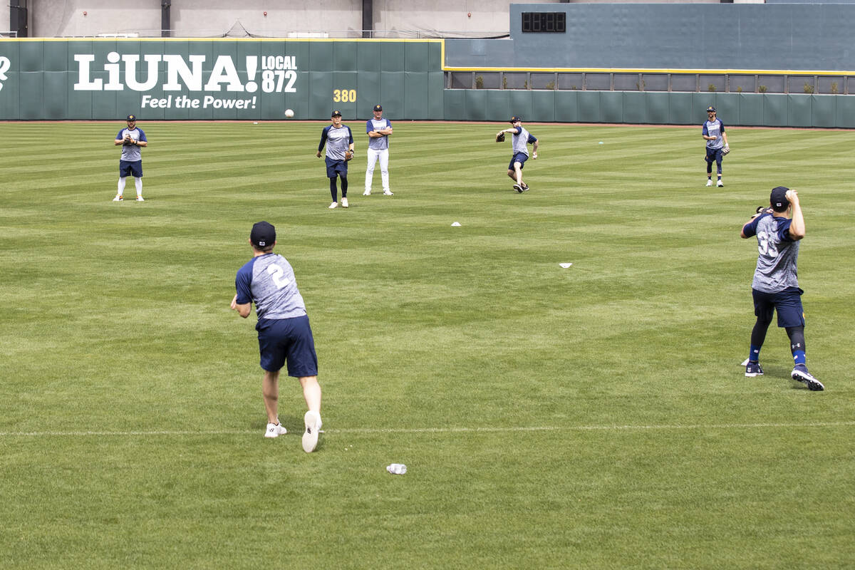 The Las Vegas Aviators players, including infielder Nick Allen (2) and catcher Shea Langeliers ...