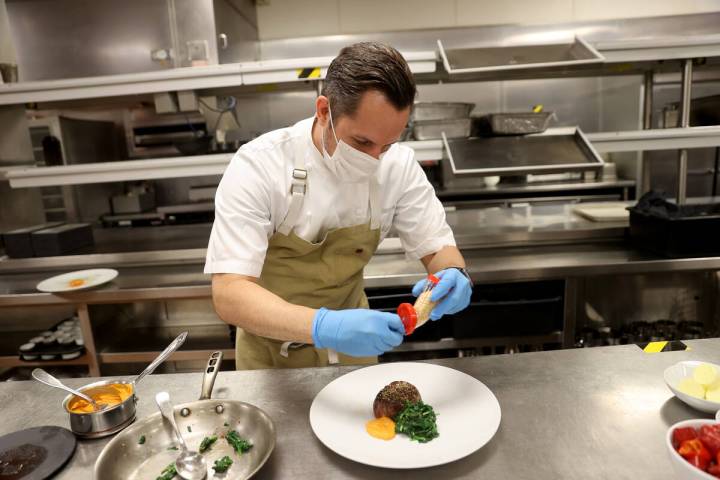 Jean Georges Steakhouse Executive Chef Chef Sean Griffin makes grilled filet mignon with spinac ...