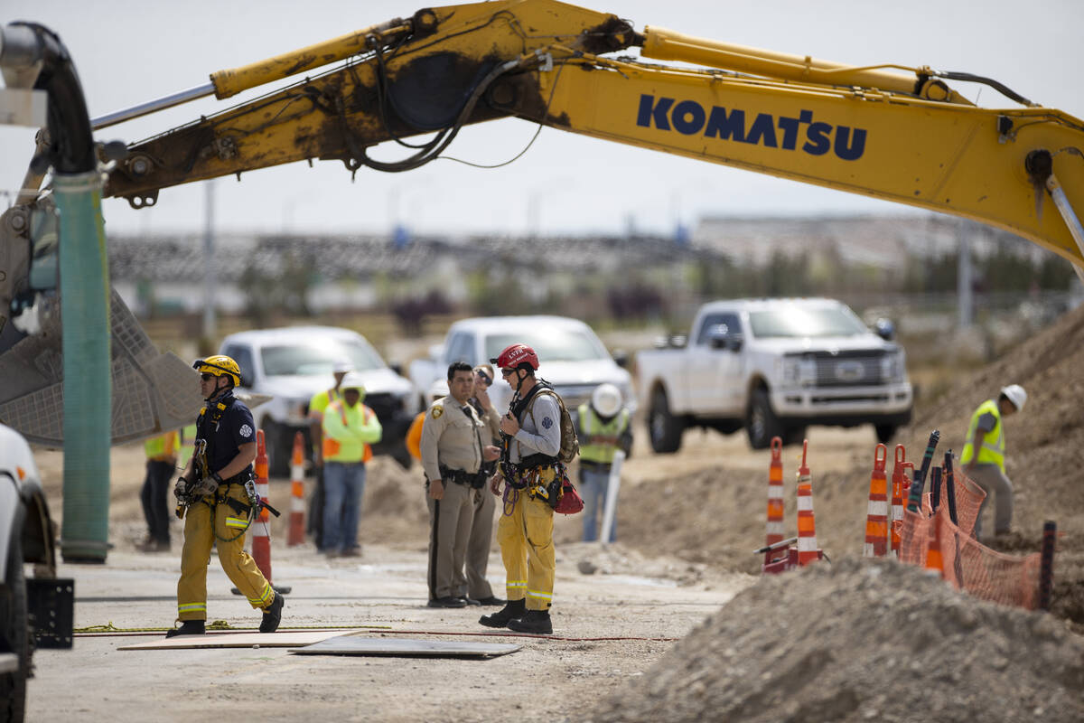 Las Vegas police and firefighters from various agencies respond to a workplace fatality at a co ...