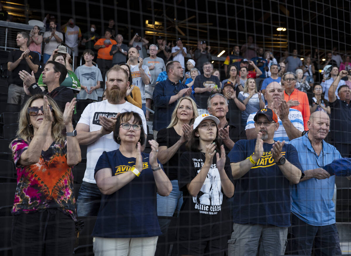 Fans applaud as the Las Vegas Aviators players take the field to face Reno Aces during team ...