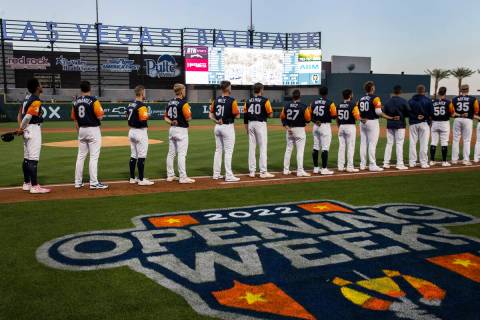 Las Vegas Aviators players place their hands over their heart during the National Anthem prior ...