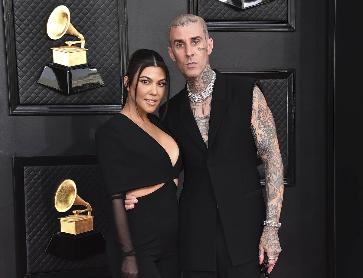 Kourtney Kardashian, left, and Travis Barker at the 64th Annual Grammy Awards in Las Vegas on A ...