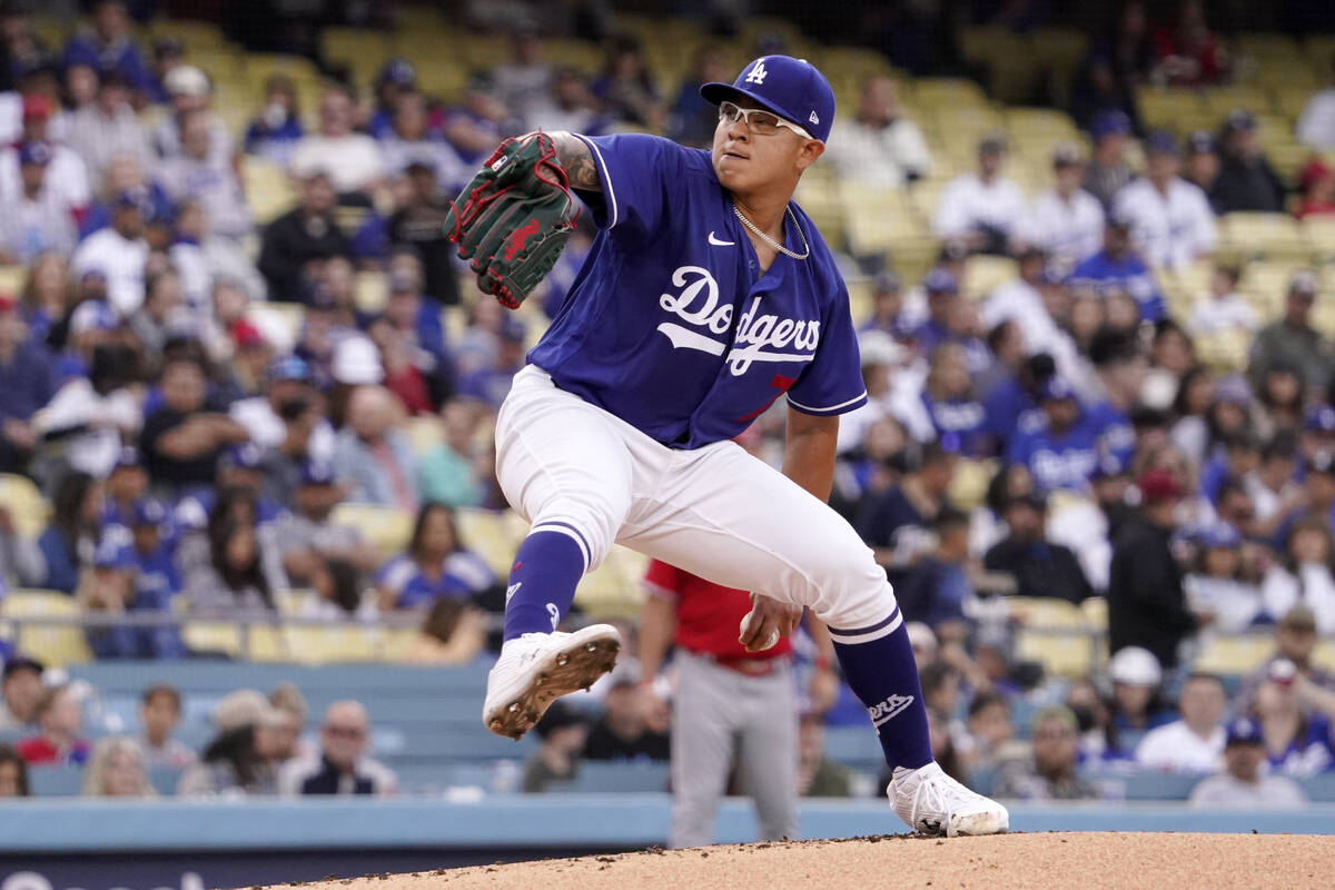 Los Angeles Dodgers starting pitcher Julio Urias throws to the plate during the first inning of ...