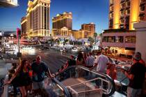 Crowds at the intersection of Flamingo Road and Las Vegas Boulevard on the Strip in Las Vegas F ...