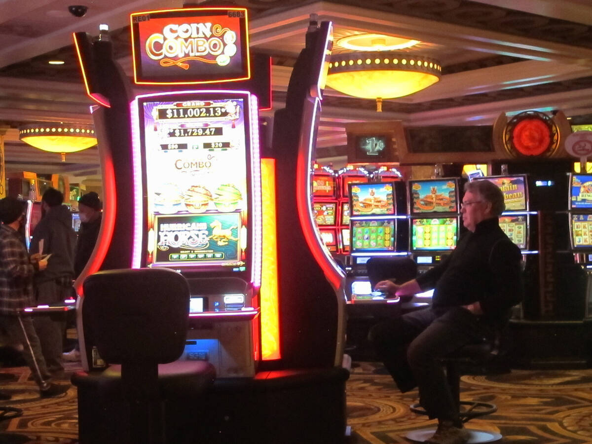 This Jan. 27, 2022, photo shows a gambler playing a slot machine at Caesars casino in Atlantic ...