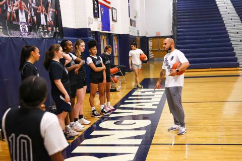 Spring Valley coach Billy Hemberger, right, talks with his players during basketball practice a ...