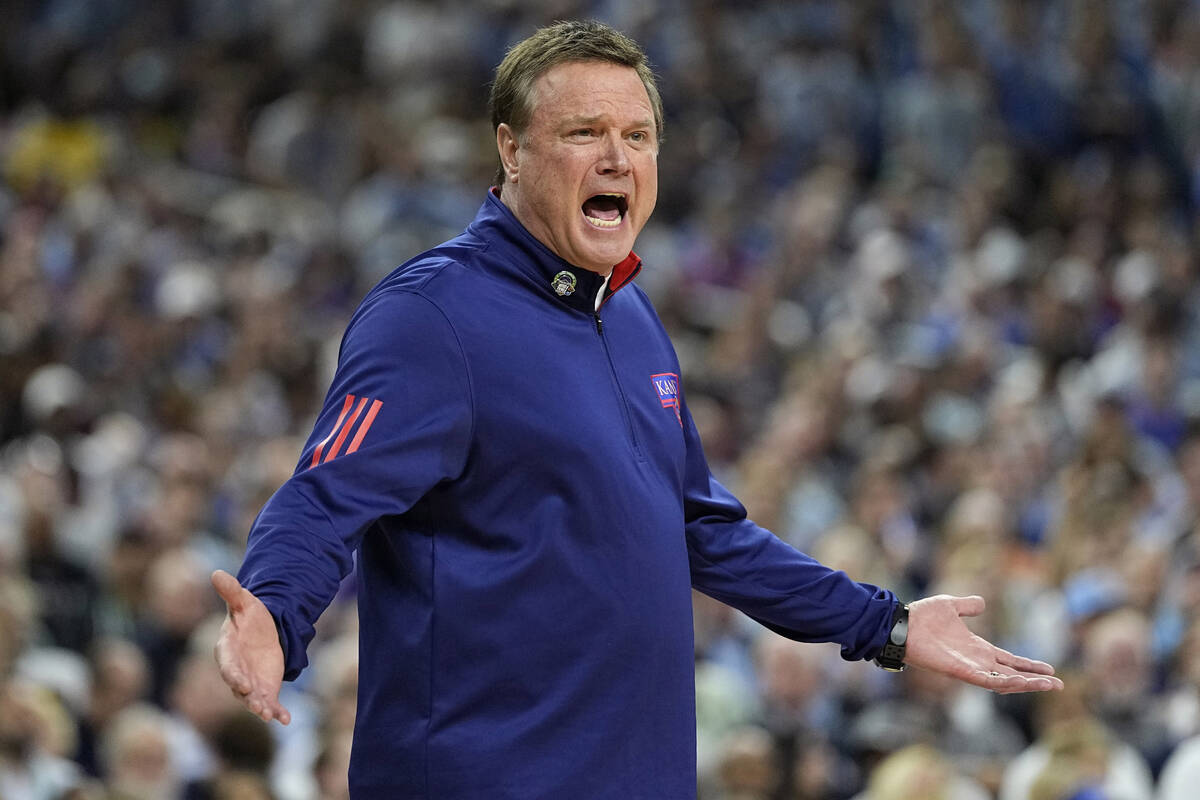 Kansas head coach Bill Self yells during the first half of a college basketball game against No ...
