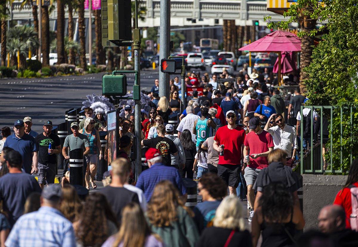 Pedestrians crowd the Las Vegas Strip on Wednesday, April 6, 2022, outside of the Miracle Mile ...