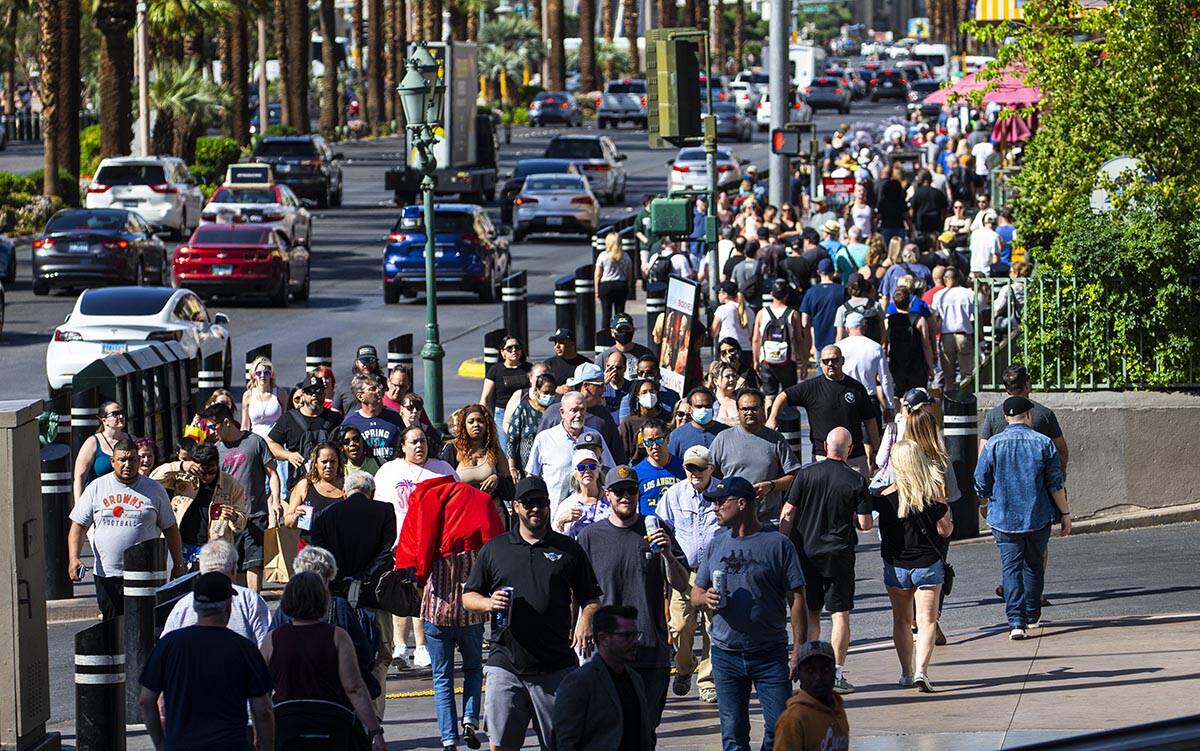 Pedestrians crowd the Las Vegas Strip on Wednesday, April 6, 2022, outside of the Miracle Mile ...