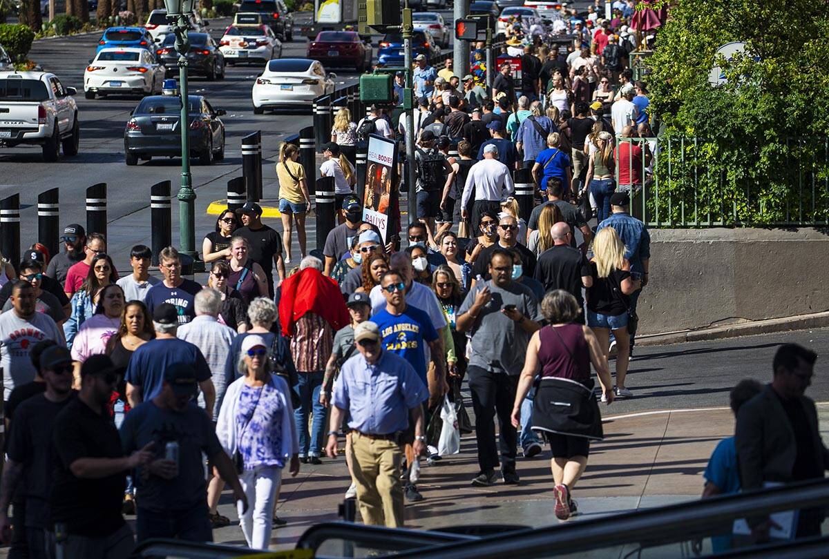 Pedestrians crowd the Las Vegas Strip on Wednesday, April 6, 2022, outside of the Miracle Mile ...