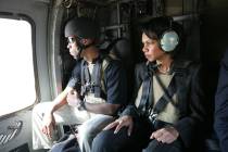 Supervisory Special Agent Lawrence Casselle on a Blackhawk helicopter with Secretary of State C ...