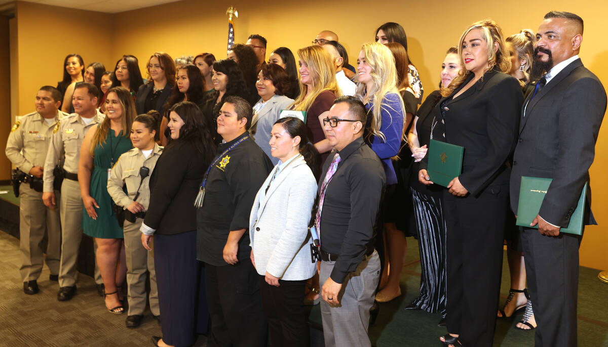 Las Vegas police personnel and Hispanic Citizens Police Academy graduates during a graduation c ...