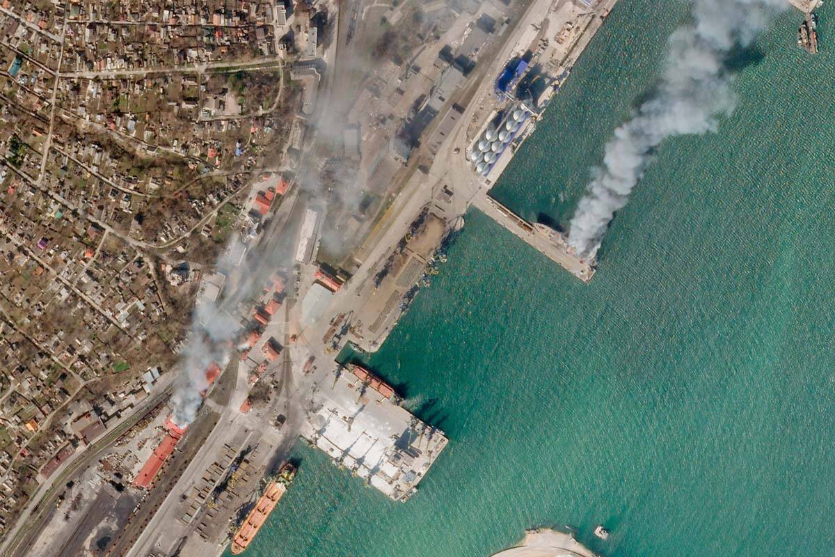 In this satellite photo from Planet Labs PBC, a Ukrainian naval vessel and a nearby building bu ...