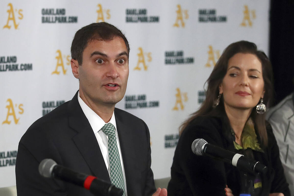 Oakland Athletics President Dave Kaval, center, speaks beside Oakland Mayor Libby Schaaf, right ...