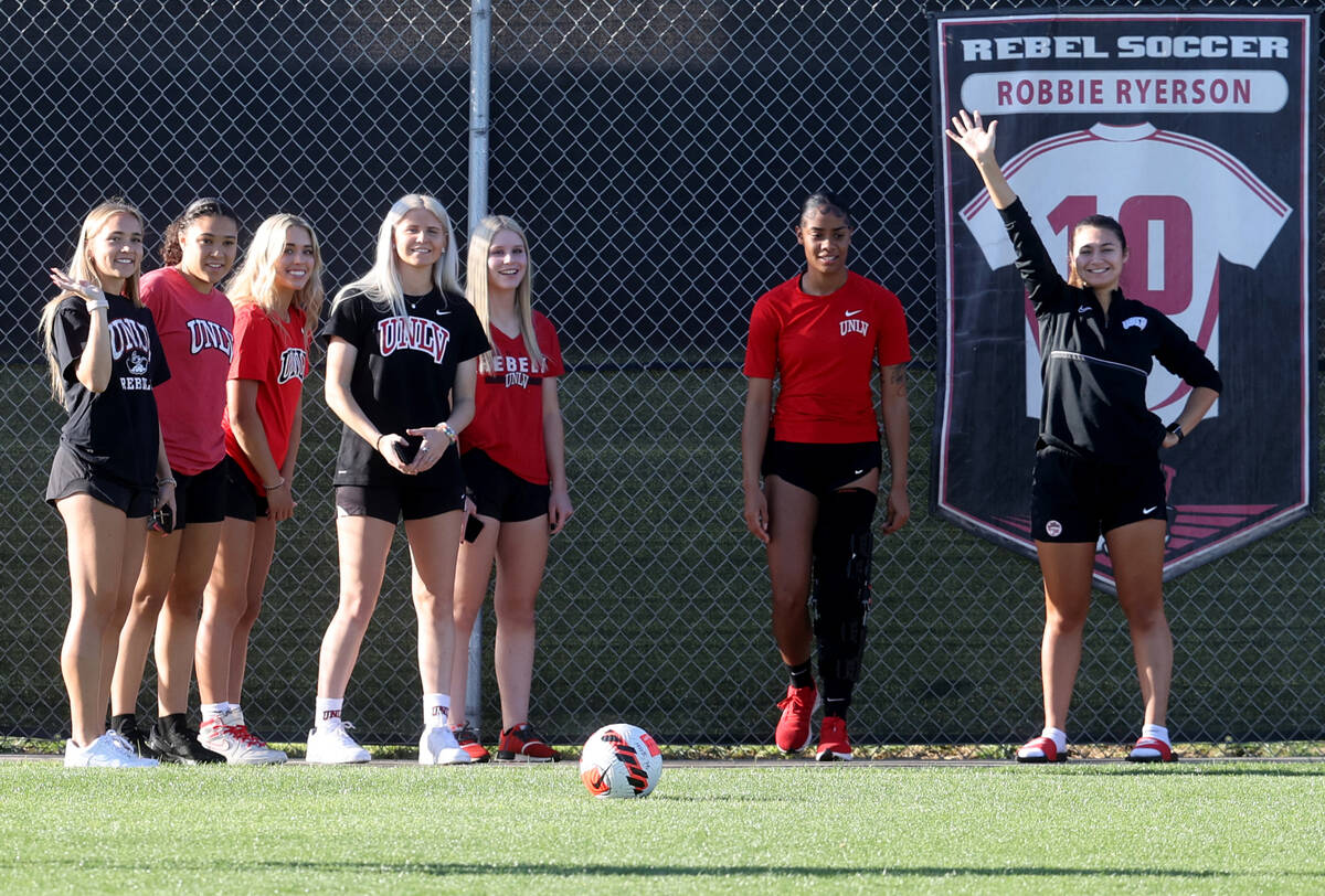 Members of the UNLV women’s soccer team gather for practice at Peter Johann Field in Las ...