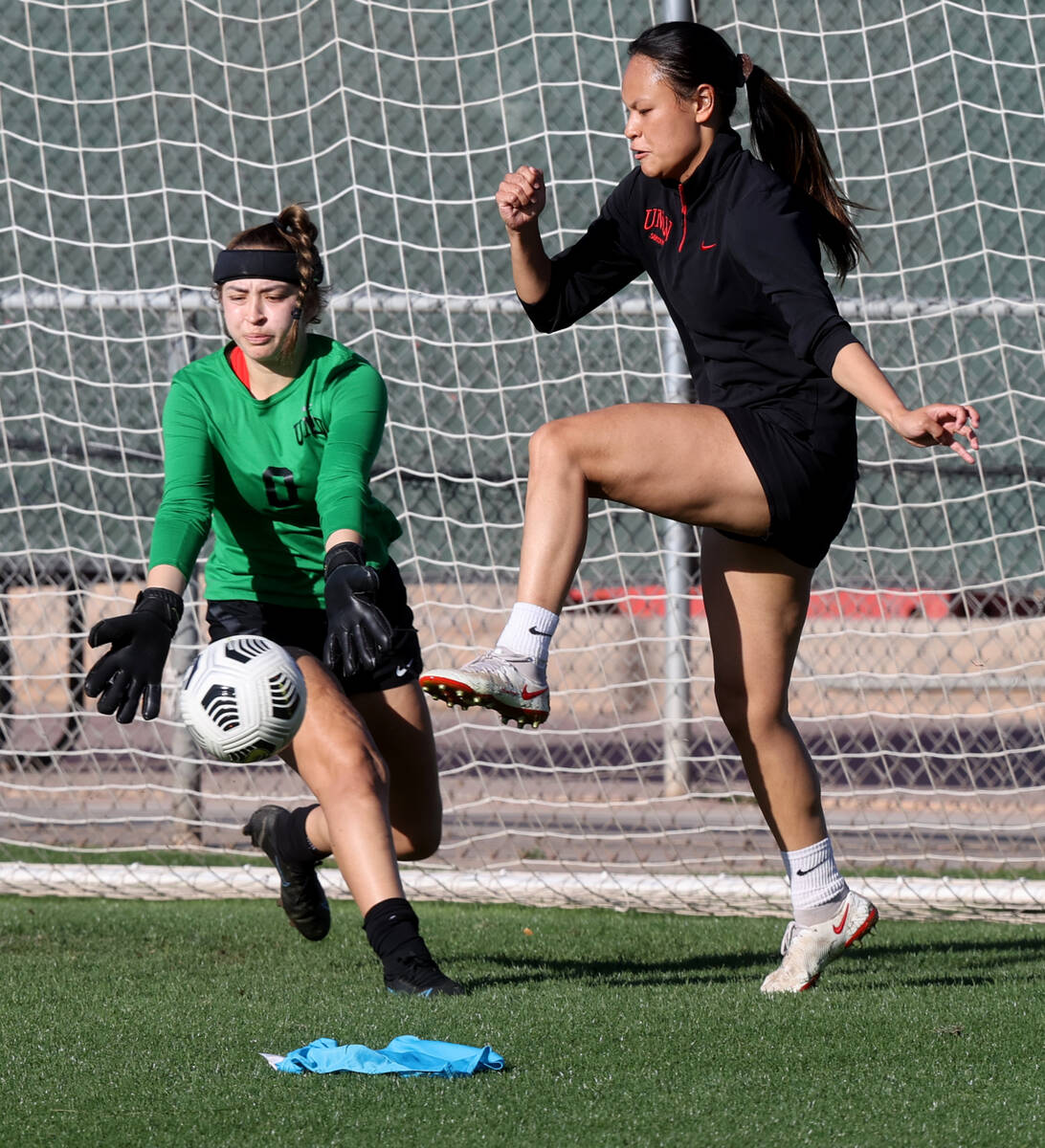 Hevanilea Haunga attempts to move a corner kick into the goal as goalkeeper Riley Liebsack defe ...