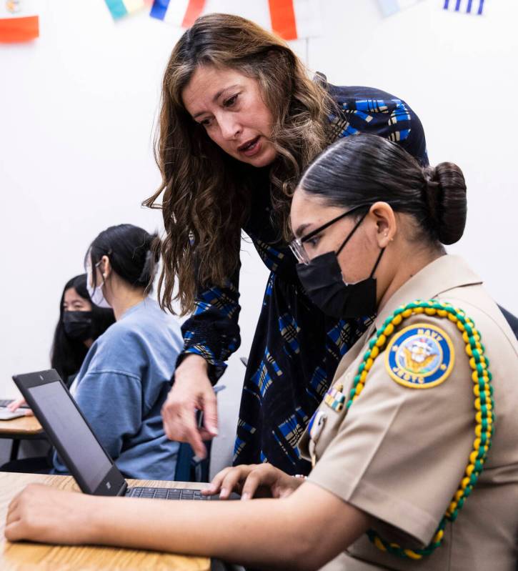 Lt. Gov. Lisa Cano Burkhead works with Yitzelle Beltran Chavez, a sophomore and Navy Junior ROT ...