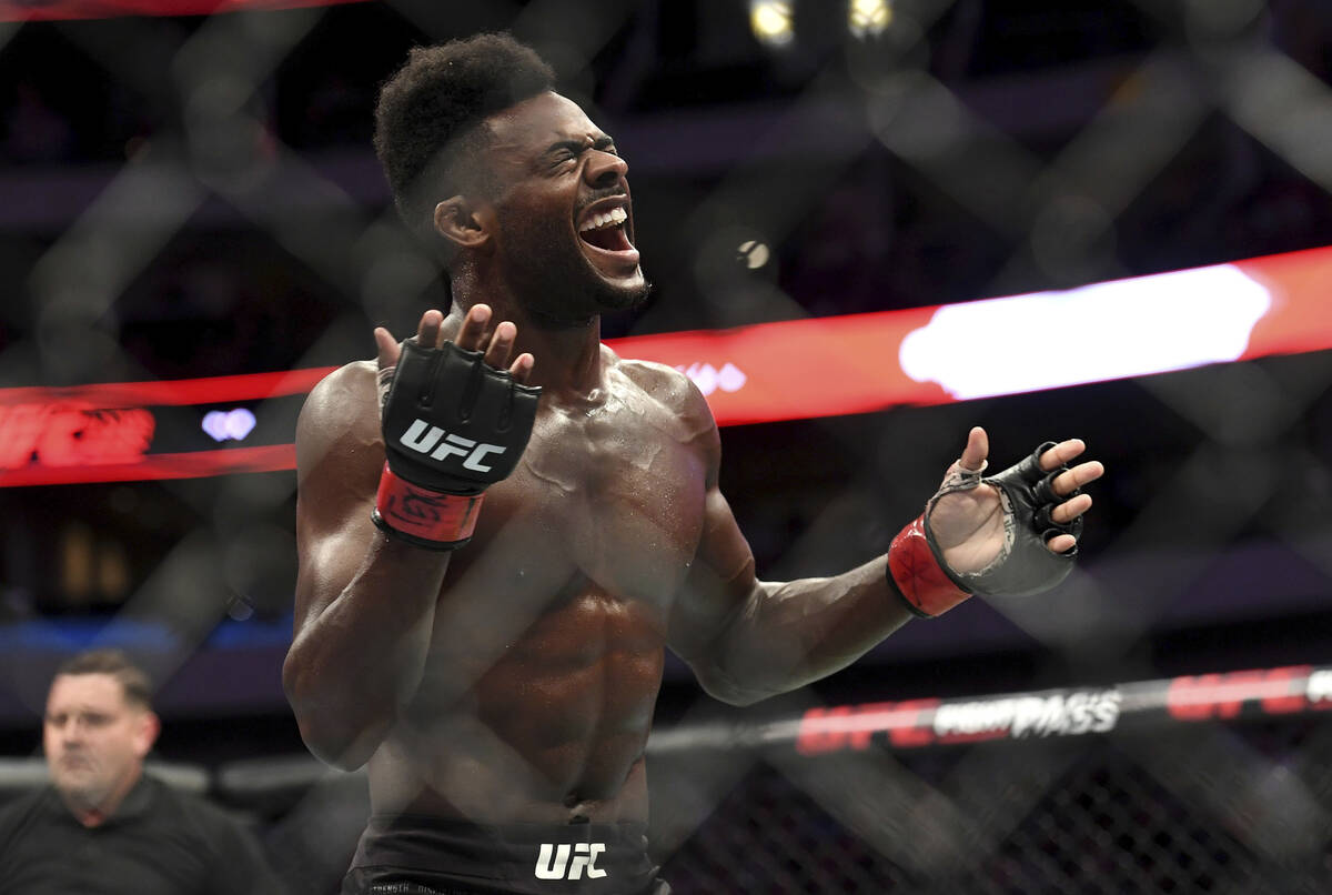 Aljamain Sterling celebrates after defeating Cody Stamann in their bantamweight mixed martial a ...
