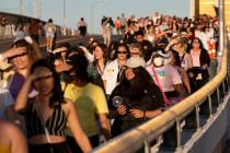 BTS fans, known as the “BTS Army” online, cross West Hacienda Avenue toward Alleg ...