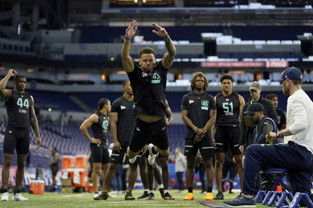 Miami defensive back Bubba Bolden (43) participates in the broad jump at the NFL football scout ...
