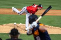 Reno Aces Ryne Nelson (29) delivers against Las Vegas Aviators infielder Nate Mondou (10) durin ...