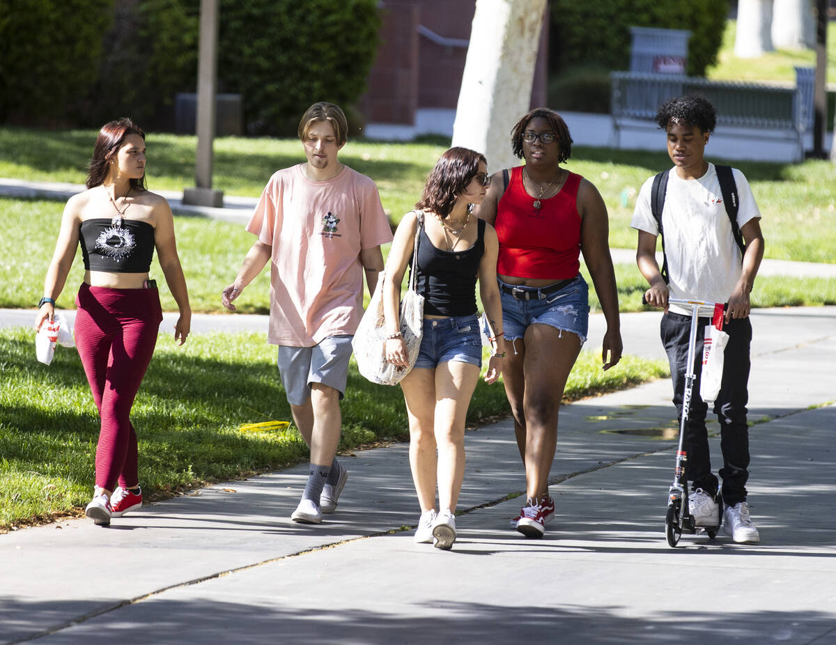Students walk around campus at UNLV on Friday, April 8, 2022, in Las Vegas. UNLV is becoming a ...