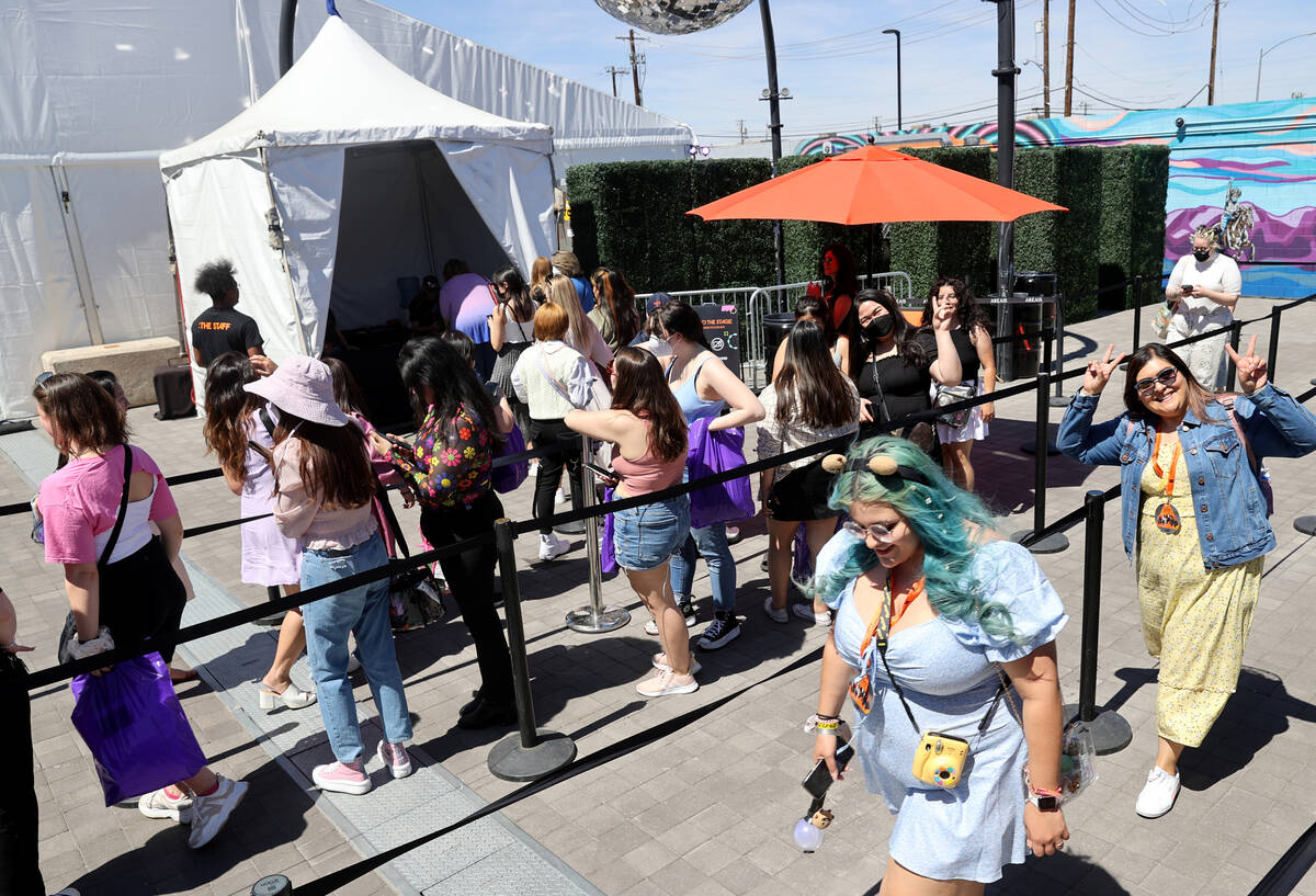 BTS fans line up to enter an exhibit dedicated to the K-Pop group at Area15 in Las Vegas Friday ...