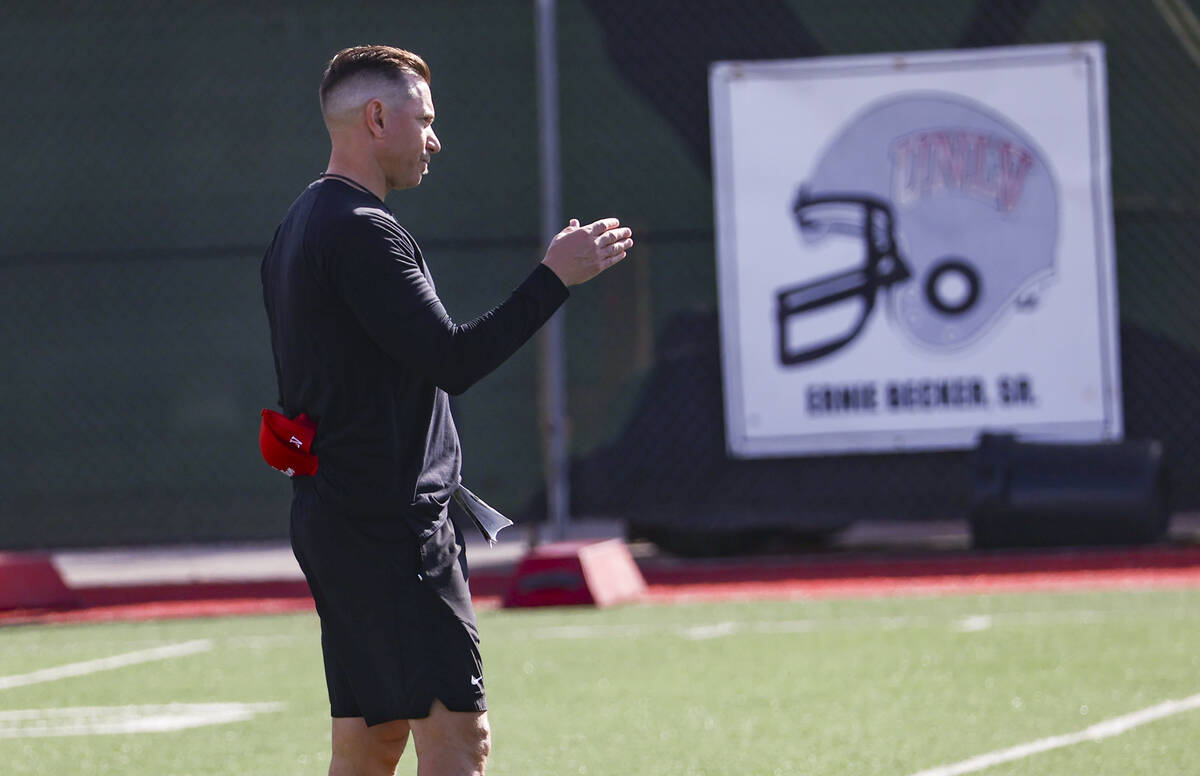 UNLV Rebels head coach Marcus Arroyo motions to players on during the first day of spring footb ...