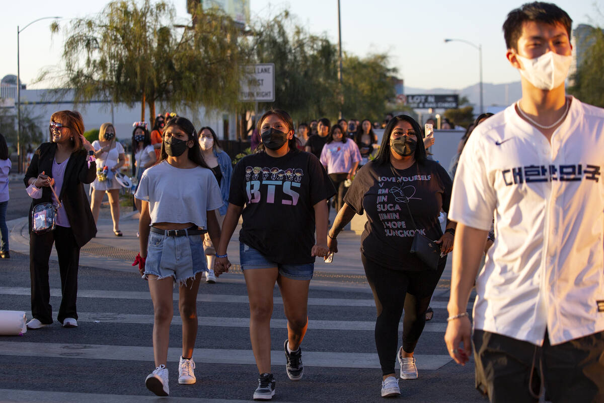 BTS fans, known as the “BTS Army” online, file into Allegiant Stadium for the Kor ...