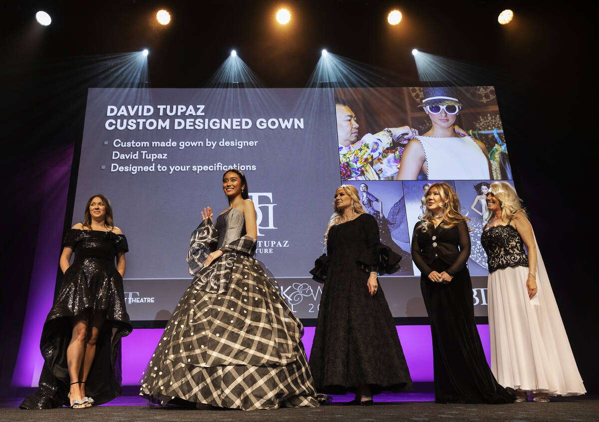 Models wear designs from David Tupaz during the silent auction portion of Nevada Ballet Theatre ...
