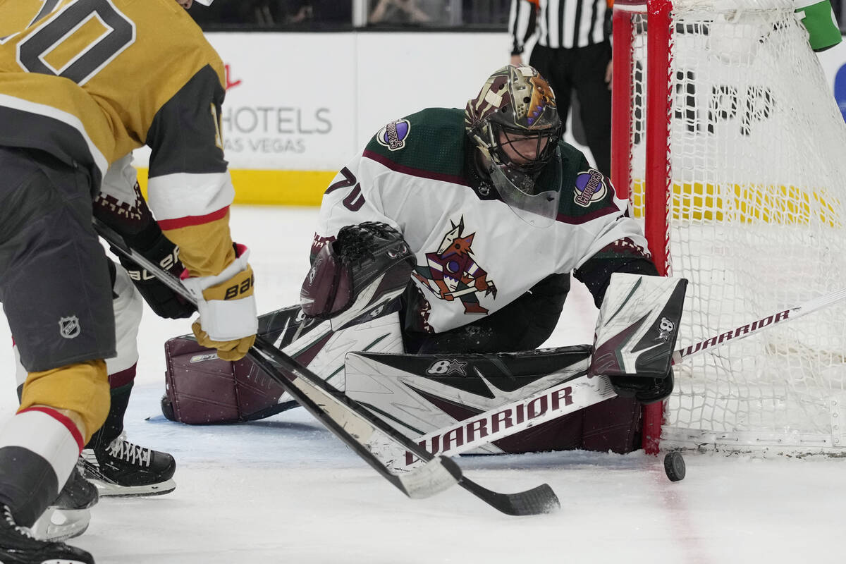 Arizona Coyotes goaltender Karel Vejmelka (70) stops a shot by the Vegas Golden Knights during ...