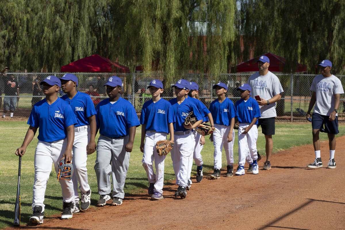Bolden Little League players take the field before the first game of their sixth season at Dool ...