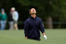 Kevin Na reacts to his shot on the eighth hole during the third round at the Masters golf tourn ...
