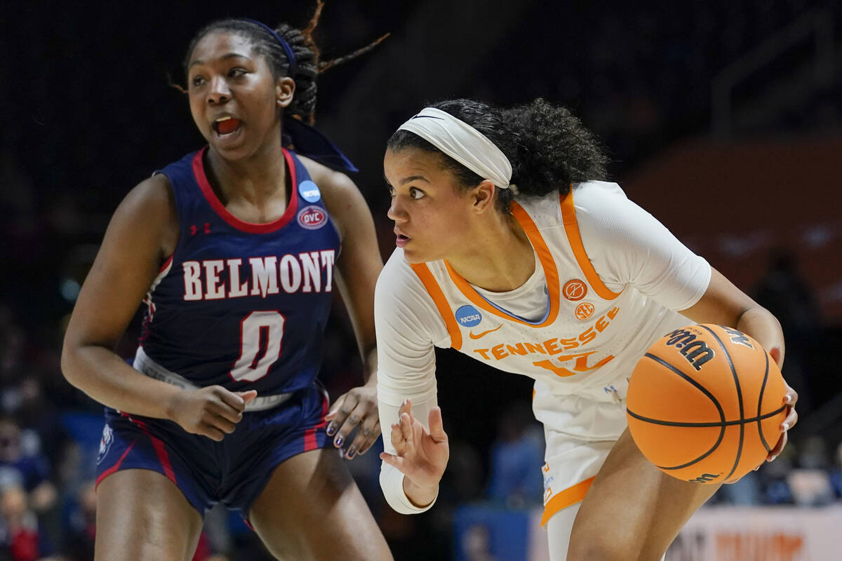 Tennessee's Rae Burrell (12) moves the ball past Belmont's Tuti Jones (0) in the second half of ...