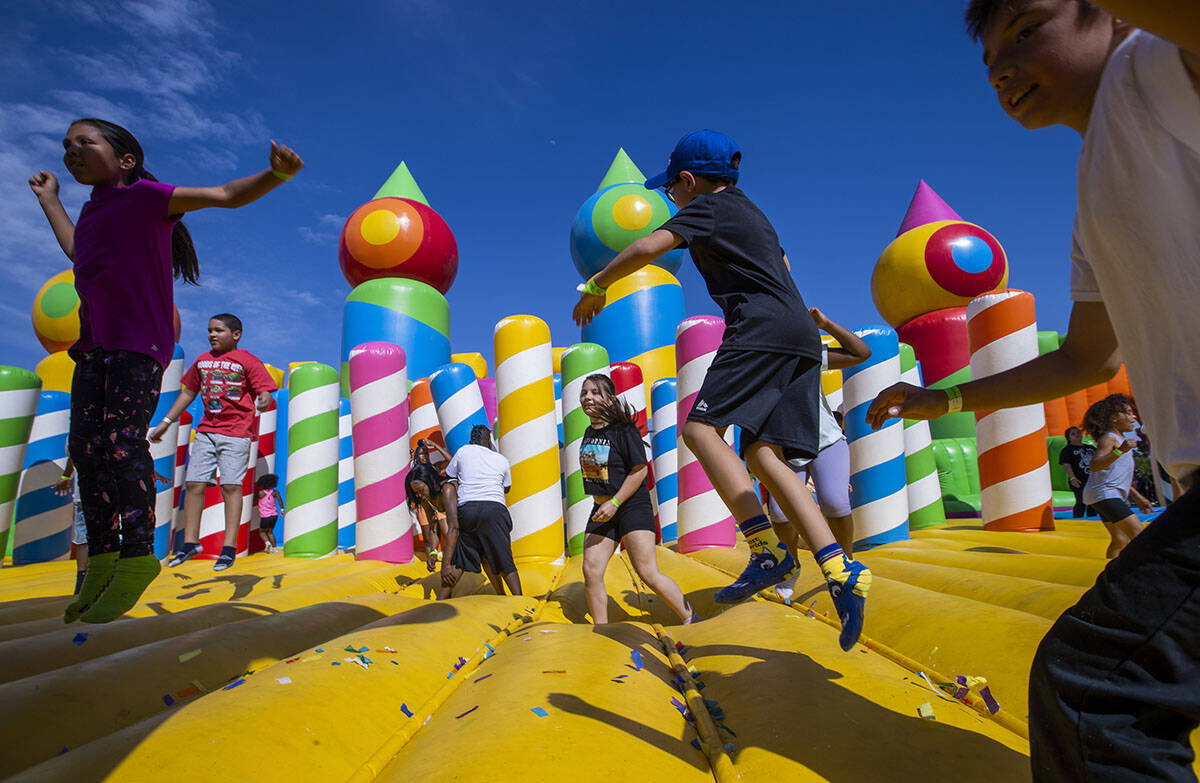 Kids bounce within the Air Space Castle attraction at the Big Bounce America 2022 tour at Craig ...