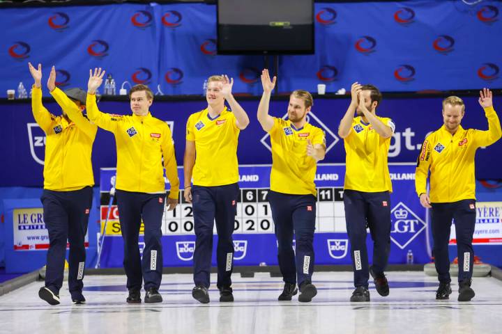 Sweden’s national team celebrates after defeating Canada in the gold medal game of the L ...