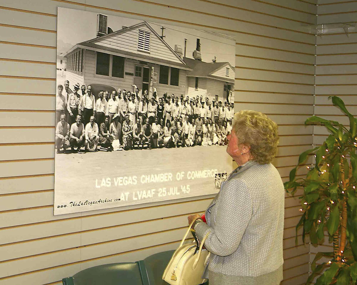 Peg Crockett looking at old photos of the Las Vegas Air Field in November 2006. (Las Vegas Revi ...