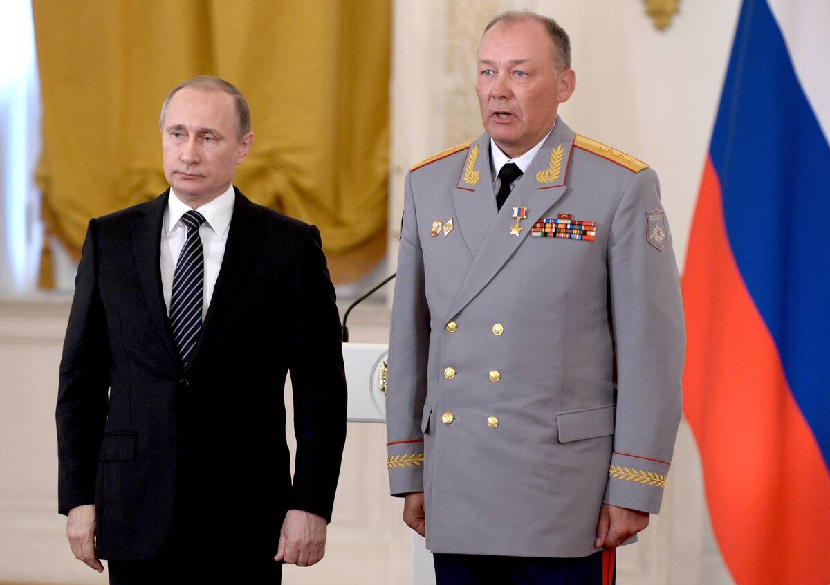 In this photo taken on March 17, 2016, Russian President Vladimir Putin, left, poses with Col. ...
