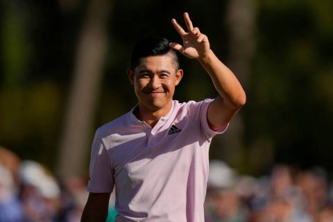 Collin Morikawa celebrates after holing out on the 18th hole for a birdie during the final roun ...