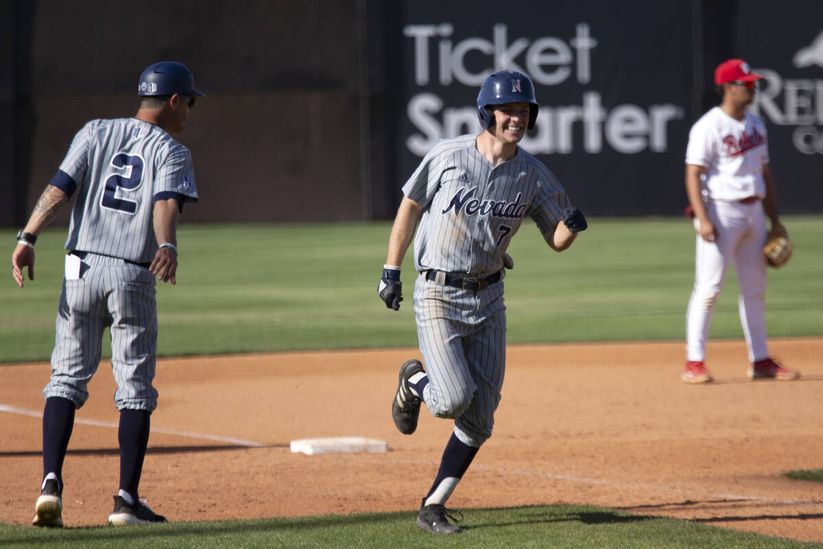 UNR outfielder Jacob Stinson rounds the bases after hitting a home run during an NCAA baseball ...