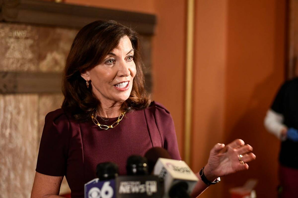 New York Gov. Kathy Hochul talks with reporters about the state budget at the state Capitol, Mo ...