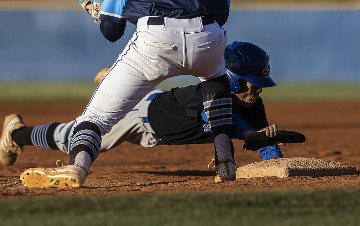 Sierra Vista’s Alex Guevara (8) is picked off at first base during a boys high school ba ...