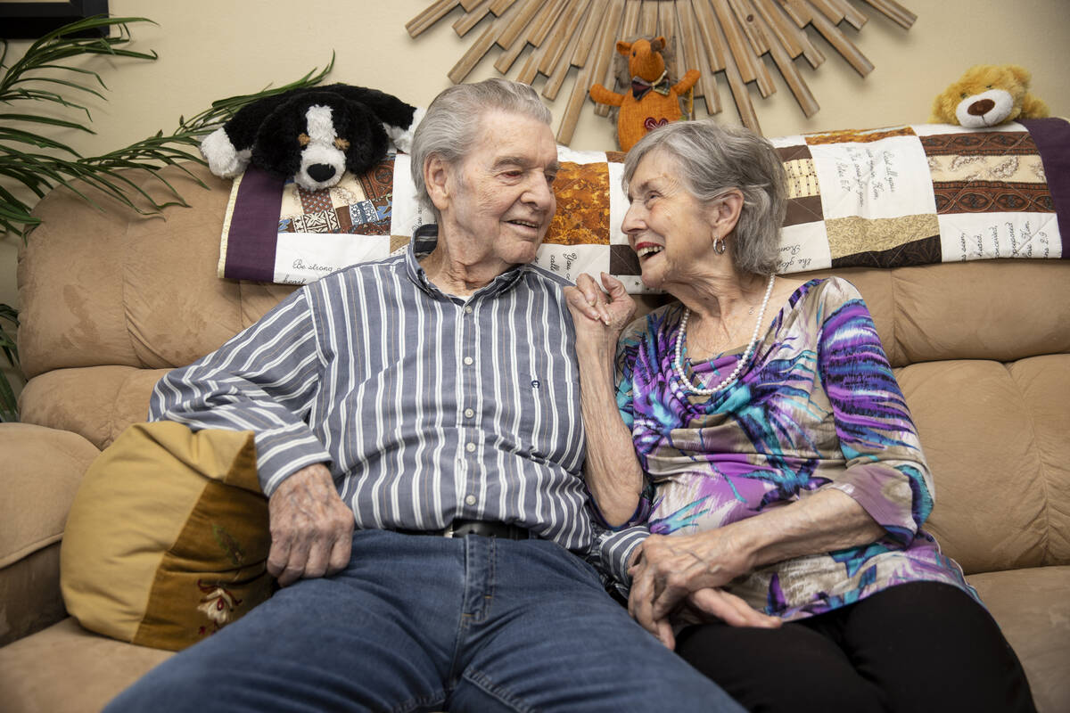 Jimmie Joe Monroe, 88, left, and his wife Florrine Enns, 85, pose for a phot at their Henderson ...