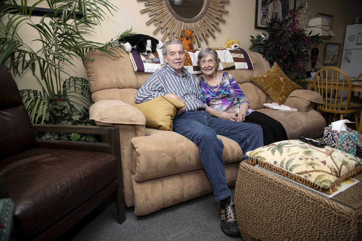 Jimmie Joe Monroe, 88, left, and his wife Florrine Enns, 85, pose for a phot at their Henderson ...