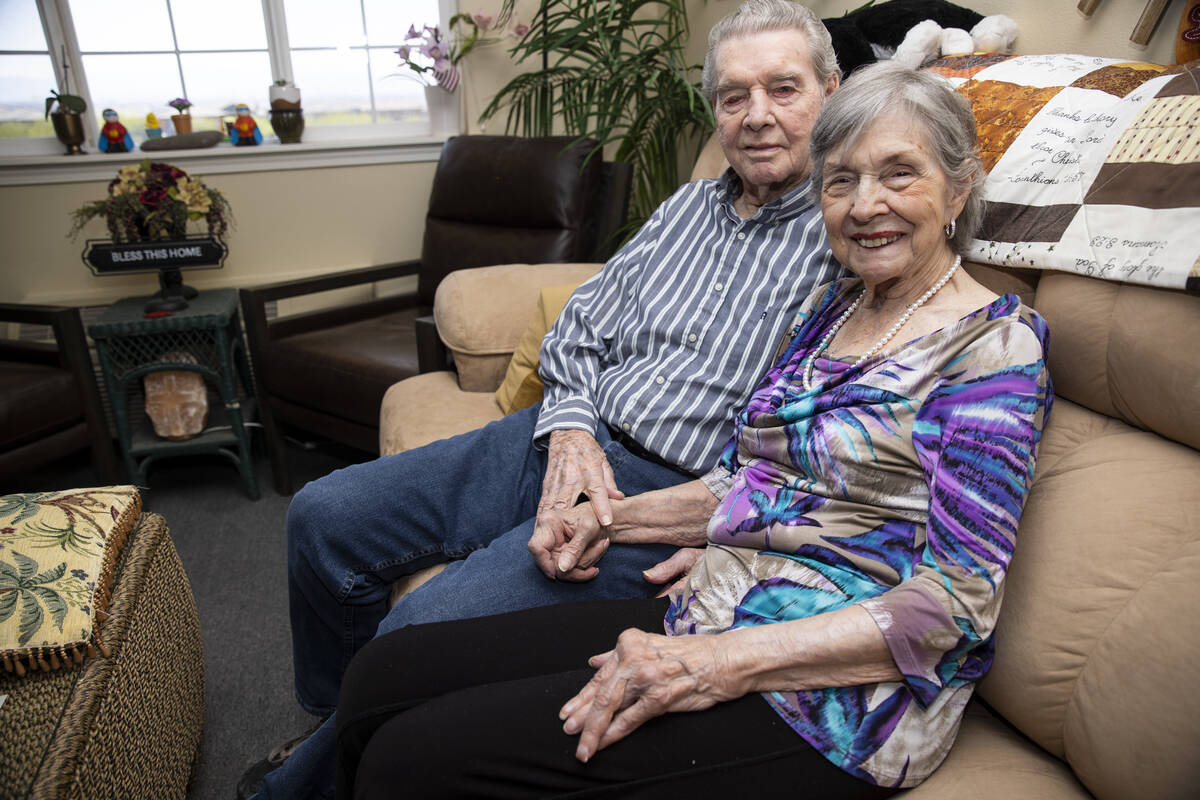 Jimmie Joe Monroe, 88, left, and his wife Florrine Enns, 85, pose for a phot at their Henderson ...